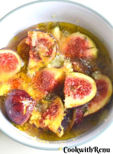 Marinated Fig with oil, lemon juice and vinegar in a bowl.