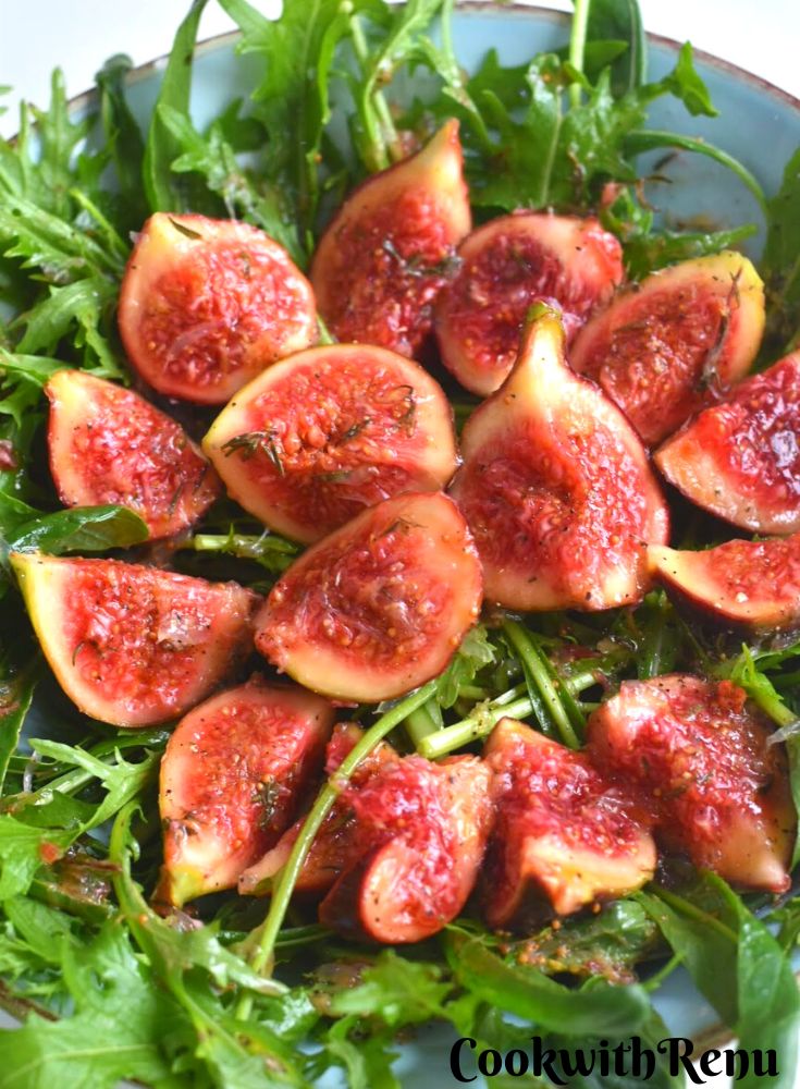 Plating Salad in a blue bowl.