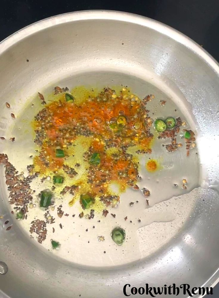 Red Chili and Turmeric Powder added to oil