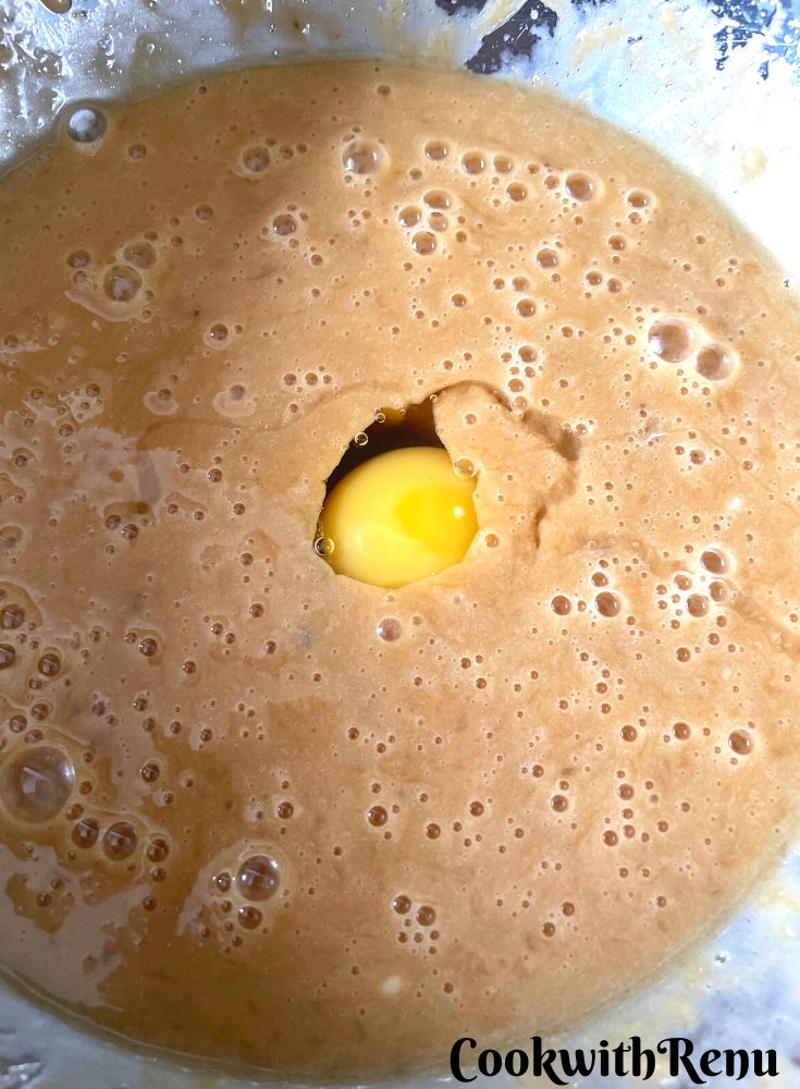 Egg added to Sugar in a bowl.