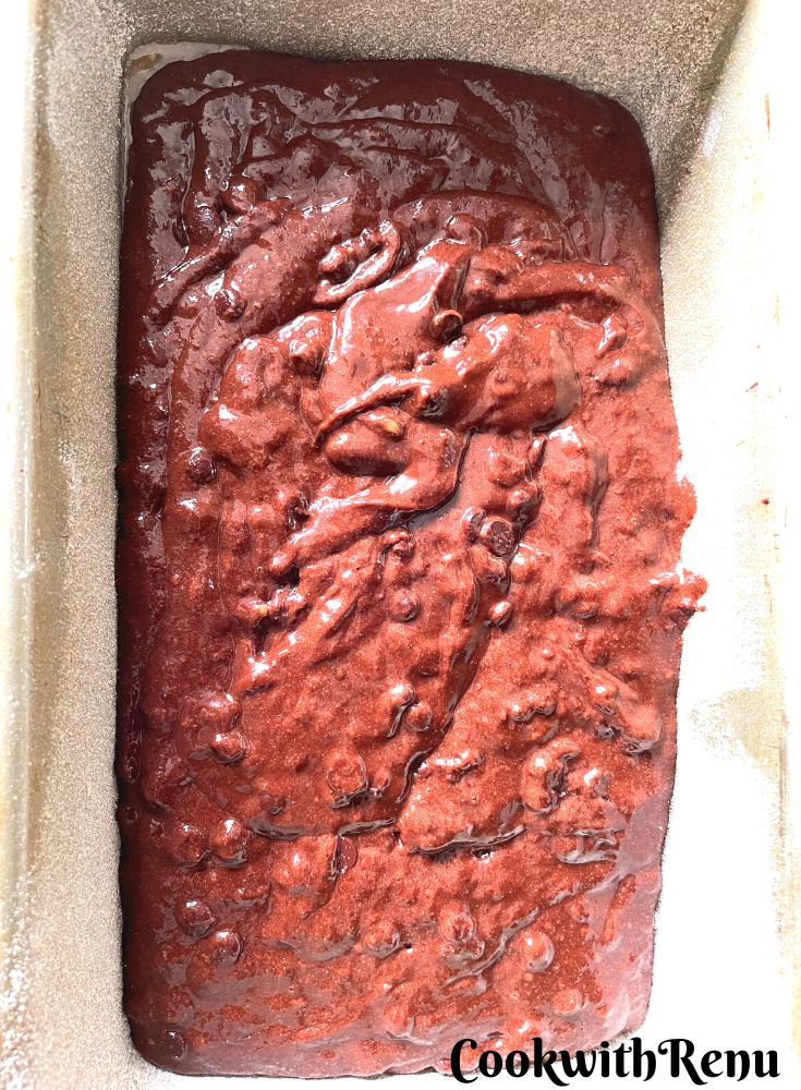 Chocolate banana bread ready to be baked in a loaf tin.