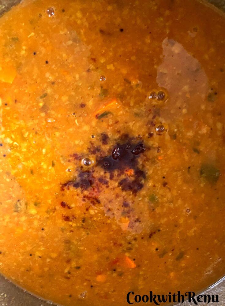 Adding of Jaggery in sambar.