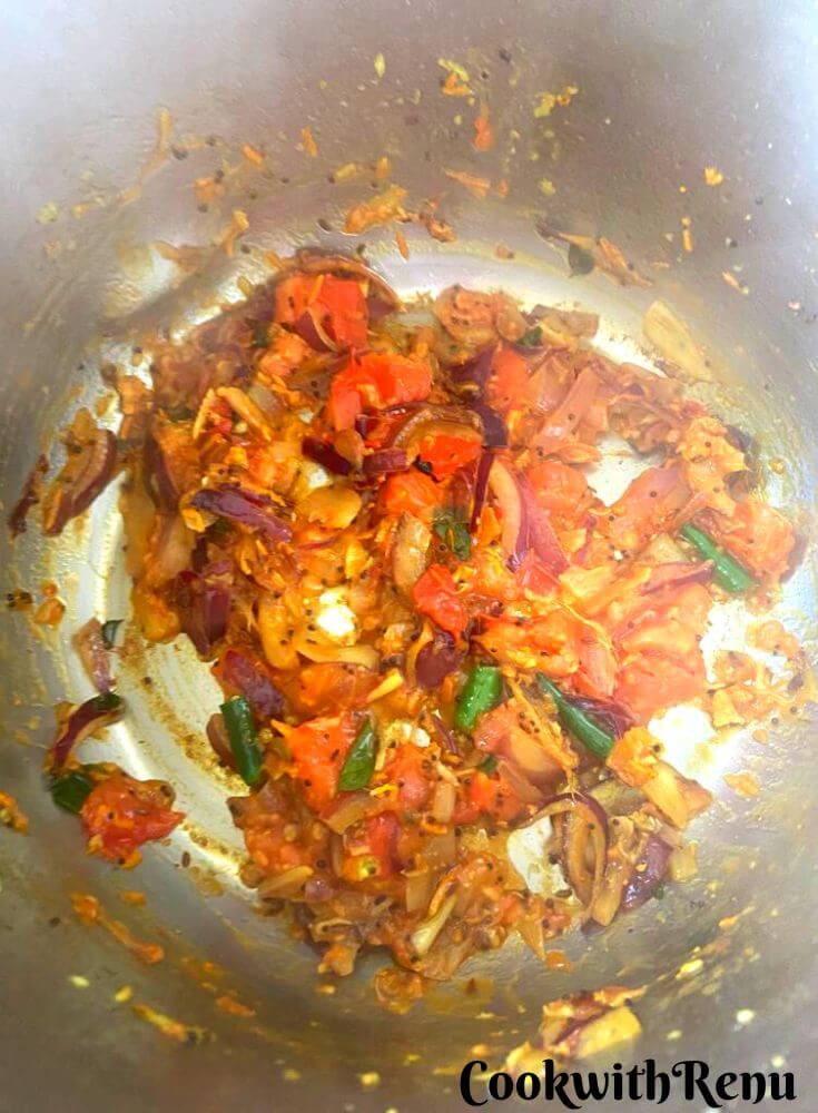 Cooked tomato and onion mixture.