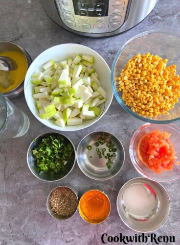 Ingredients for Lauki Chana Dal seen on a table.