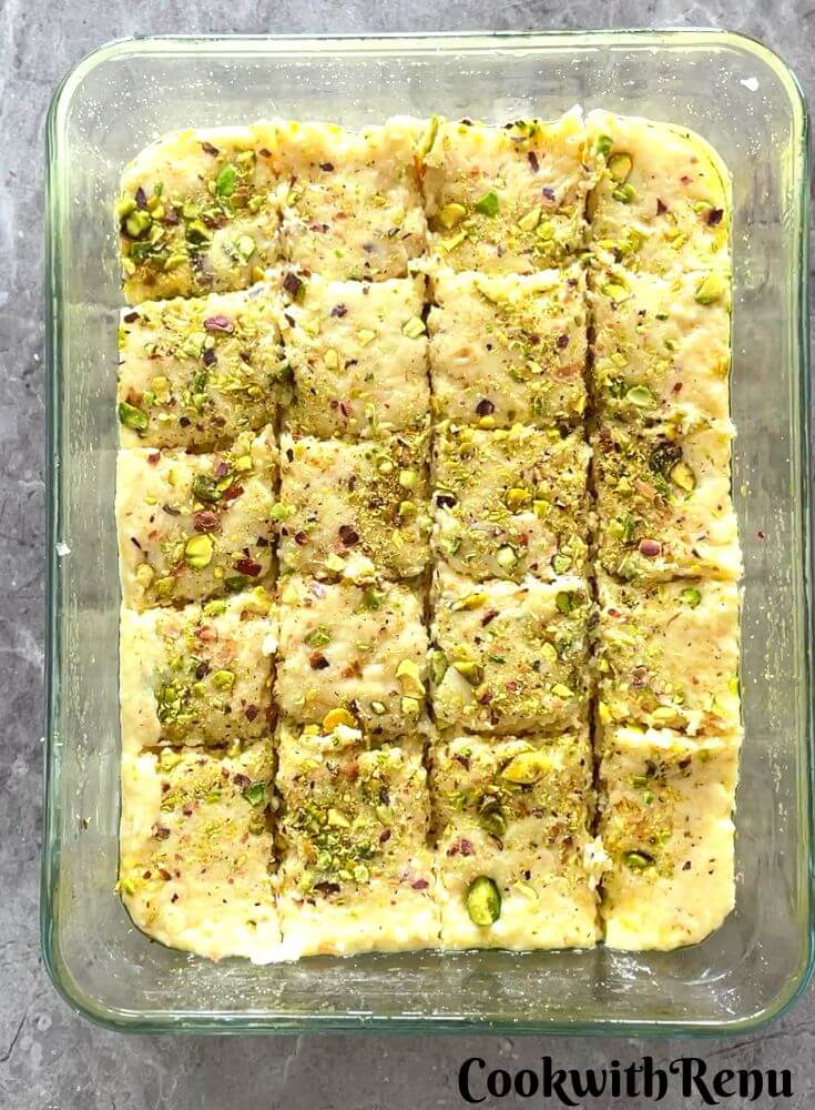 Setting up the burfi in a tray.