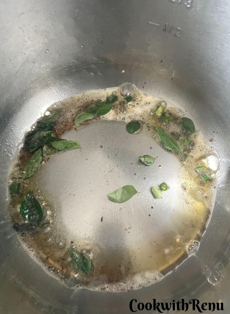 Tempering of cumin seeds, mustard seeds and curry leaves