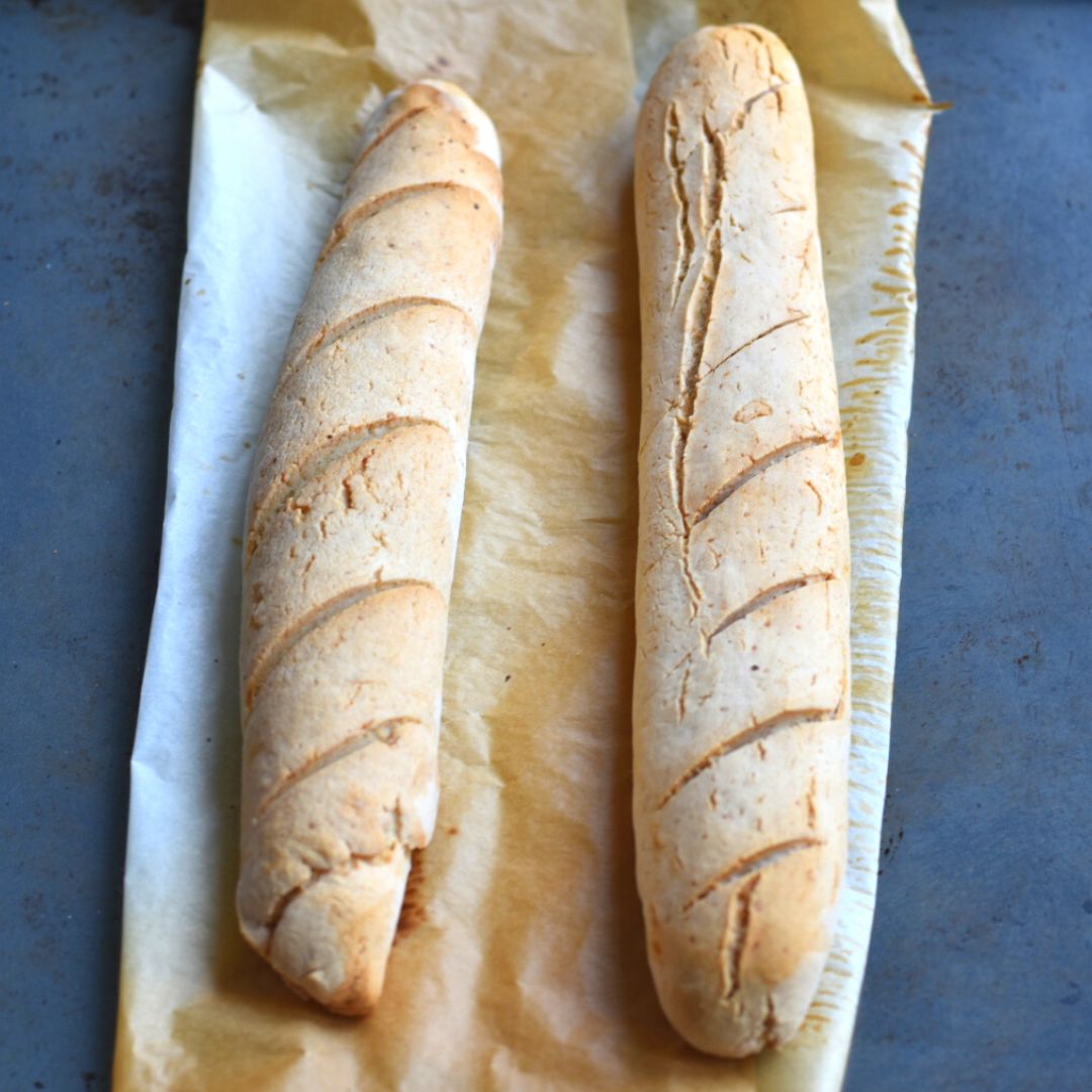 Baked Baguettes on a parchment paper in a baking tray