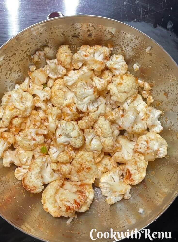 Marinated Cauliflower in a steel bowl.