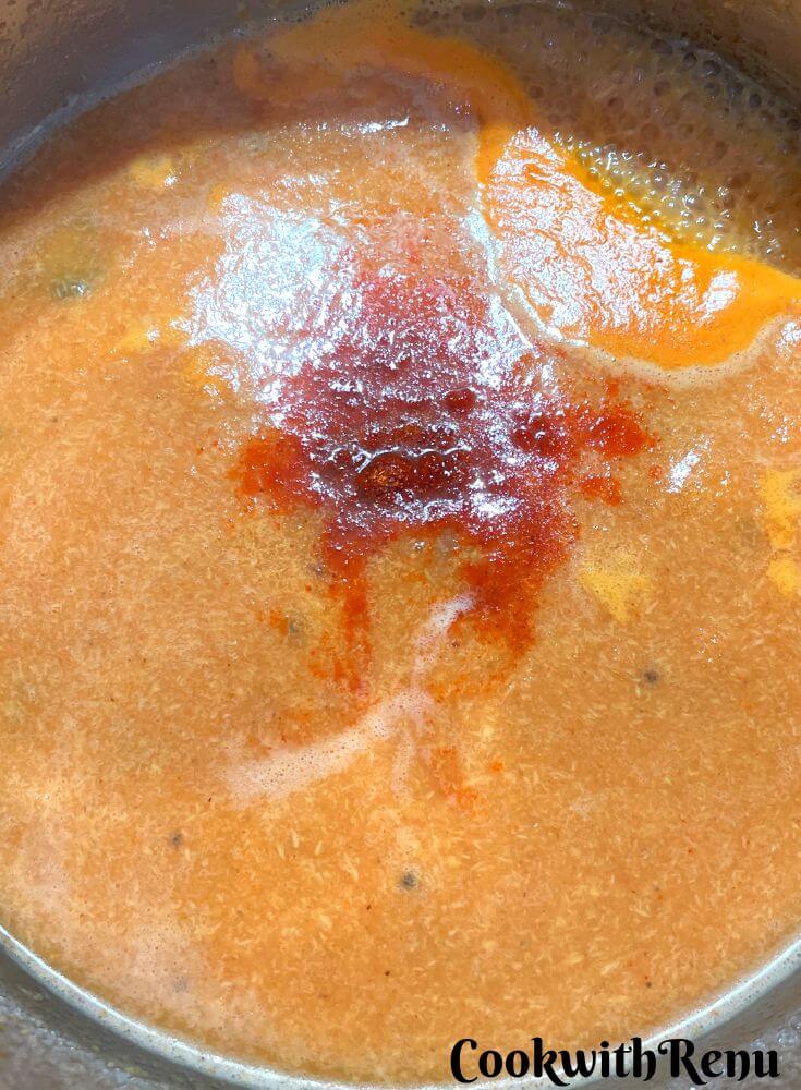 Adding of red chilli powder.