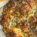 Halloumi Cheese, Olive, and Mint half bread in a pan.