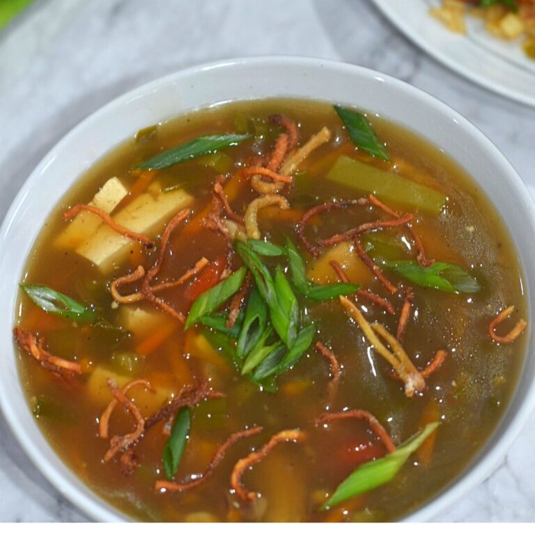Vegan Hot and Sour Soup served in a white bowl.