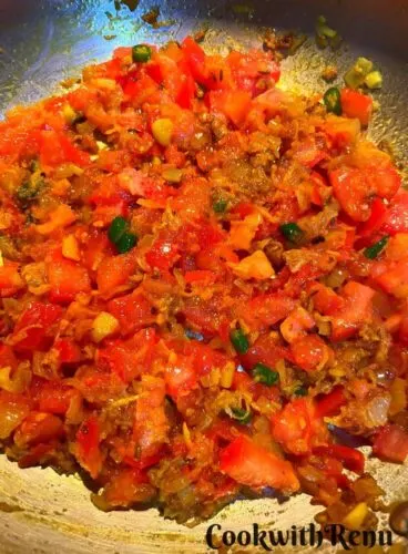 Cooking of masala with tomatoes