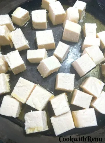 Home made Paneer Getting Shallow fried in a pan.