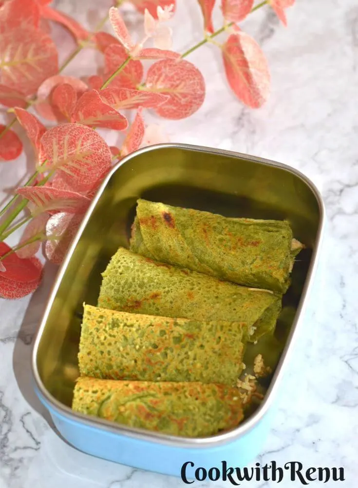 Oats and Lentil Pancakes in kids lunch box, with some flowers in the background
