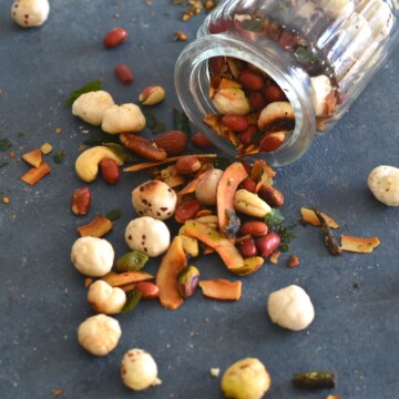 High Protein Makhana Chivda in a glass jar and some on grey board.