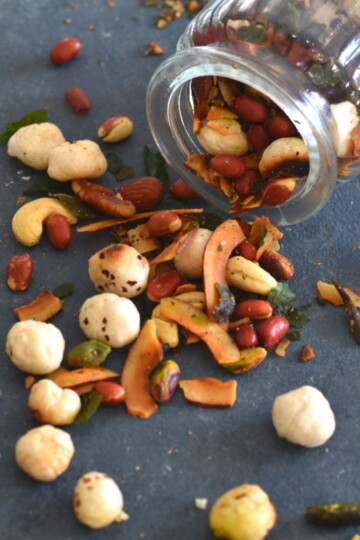 High Protein Makhana Chivda in a glass jar and some on grey board.