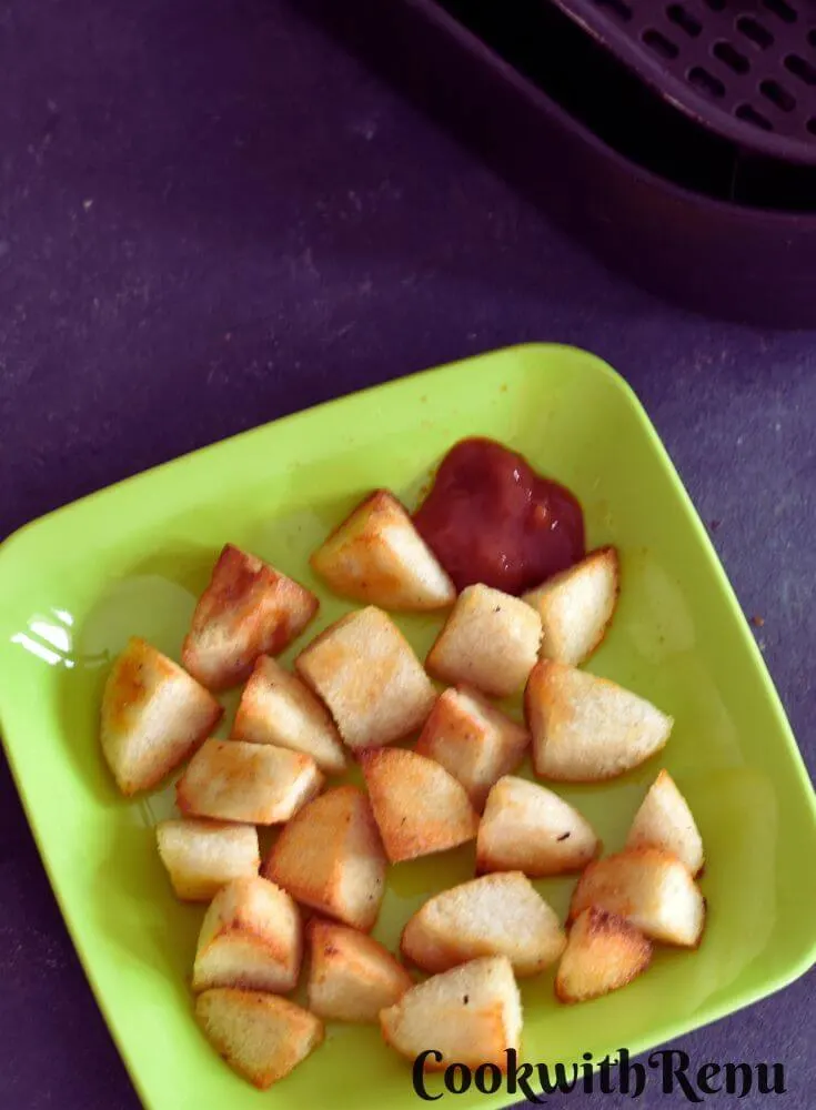 Air Fryer Idli Fry served in a green square plate.
