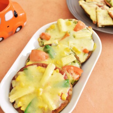 3 small, Gluten-Free Millet flour or Gluten-free Grain Pizza served in a white rectangular plate.