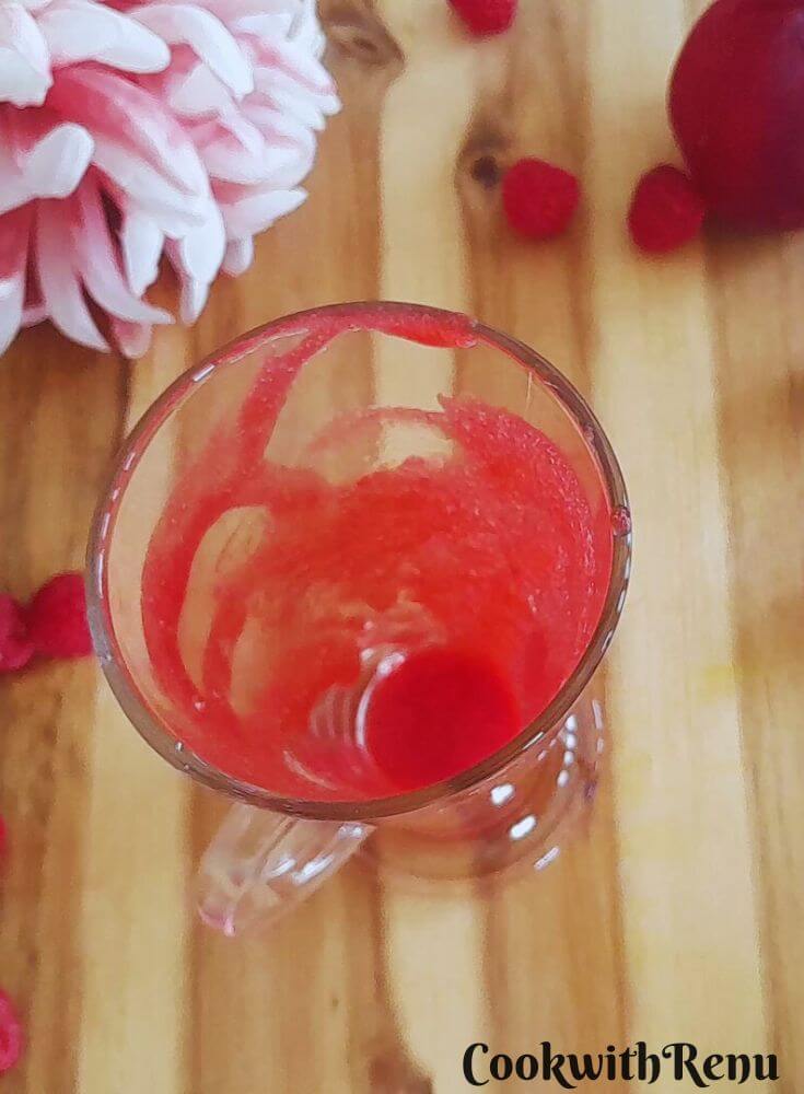 Drizzle of raspberry Juice in glass