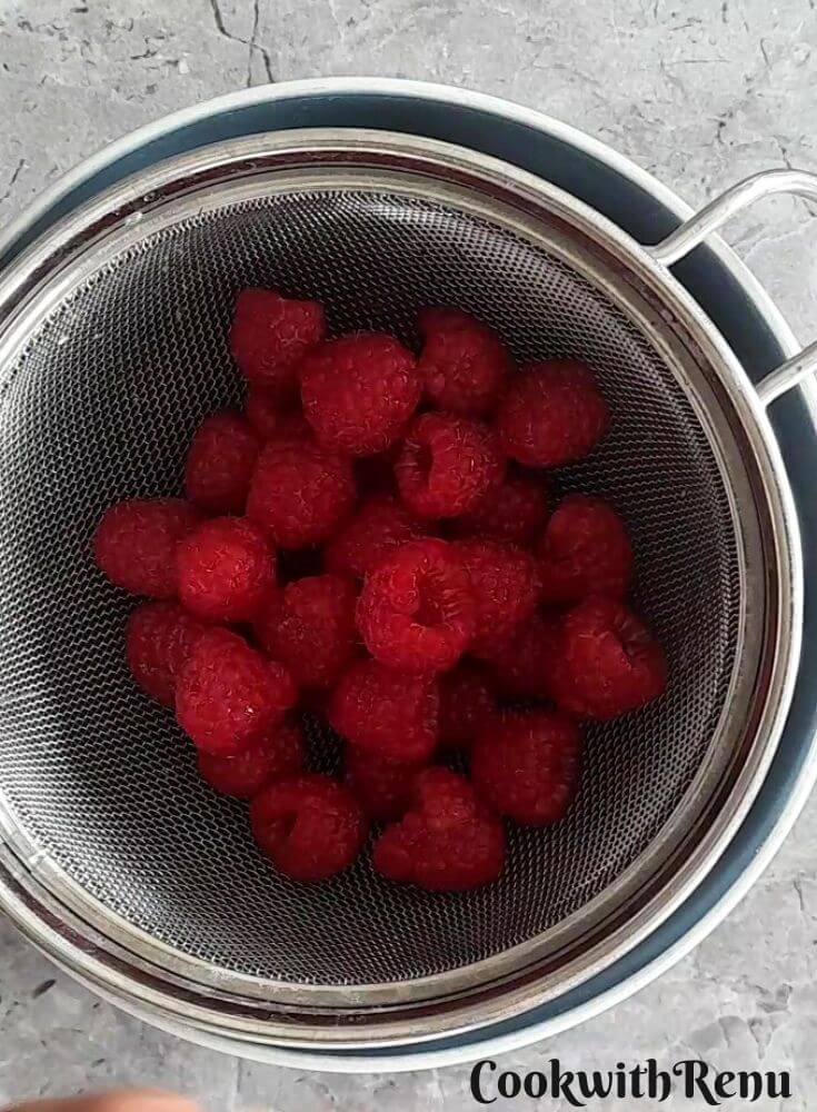Raspberry on a sieve.