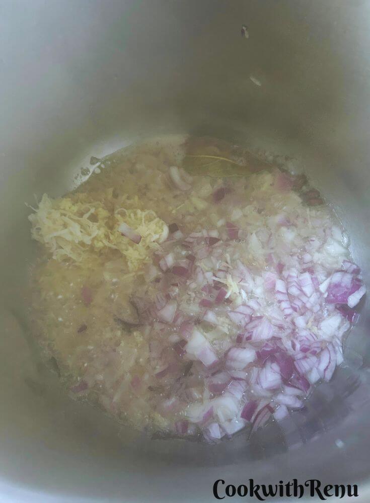 Onion, garlic and ginger added to oil in Instant Pot.