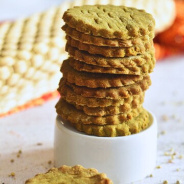Front view of a stack of Pearl Millet Crackers on a small glass bowl.