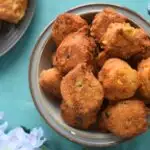 Gluten-Free Hush Puppies served in a whtie bowl with grey lining.