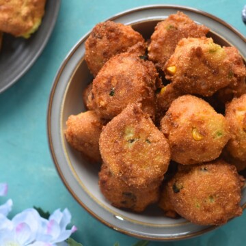 Gluten-Free Hush Puppies served in a whtie bowl with grey lining.