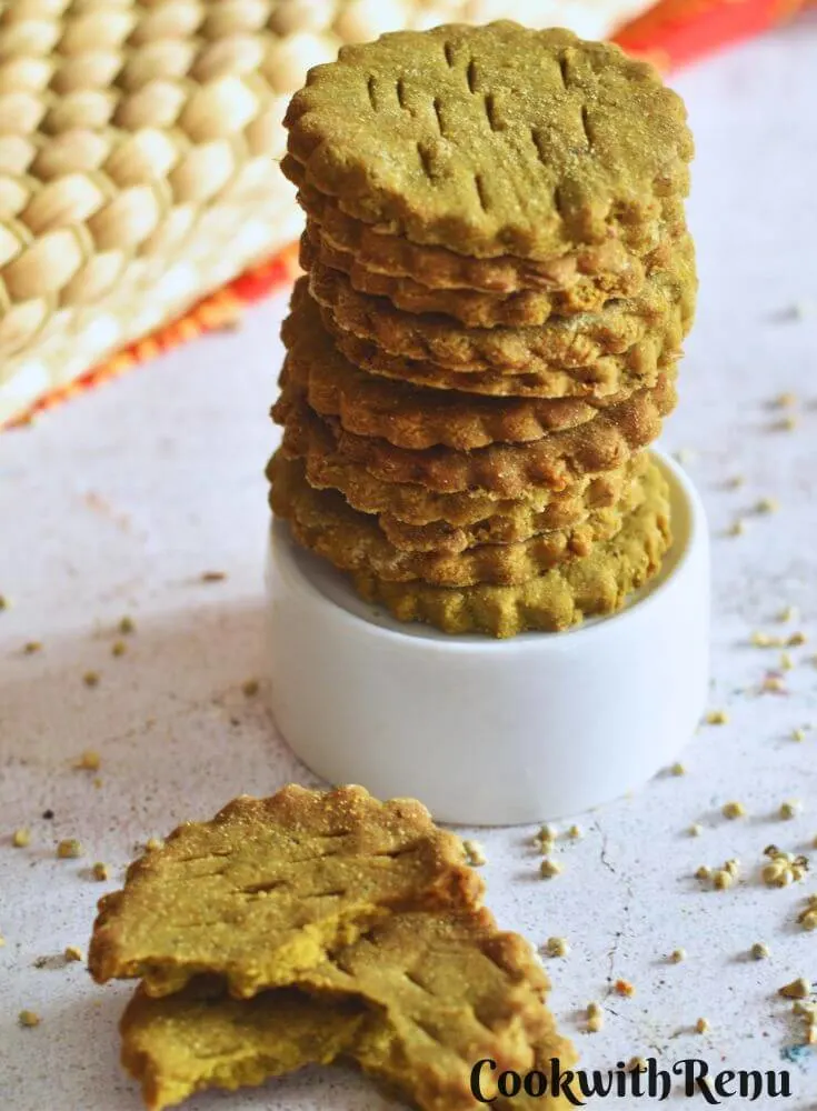 Front view of a stack of Pearl Millet Crackers on a small glass bowl. Seen in the front are some crackers showing the texture.