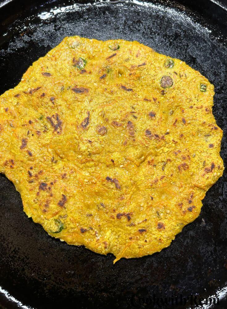 Other side of pancake is being cooked.