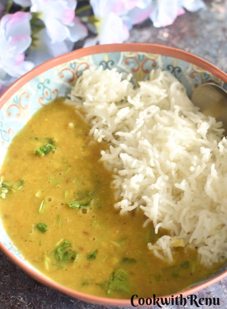 Toor Dal served in a bowl with steamed rice.