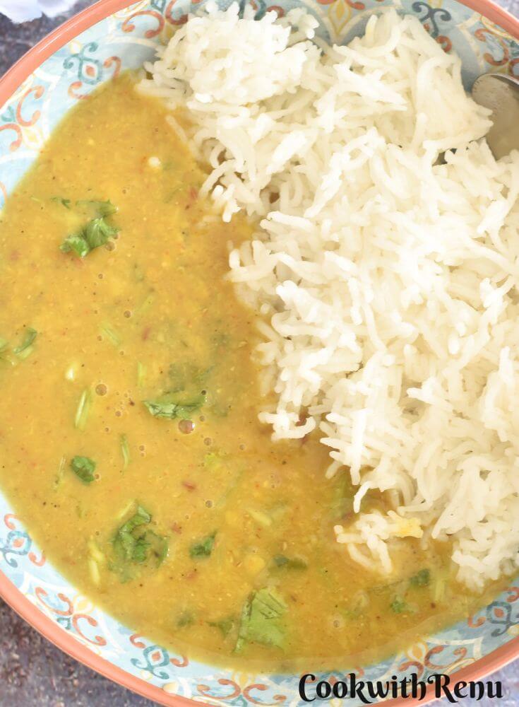 Toor Dal served in a bowl with steamed rice.