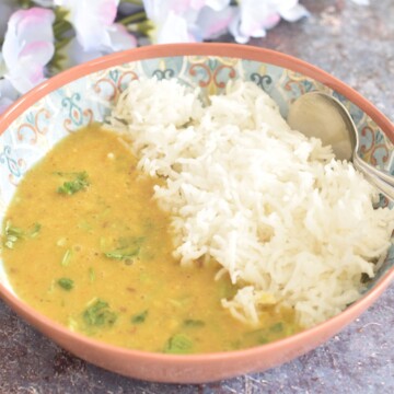 Toor Dal served in a bowl with steamed rice.