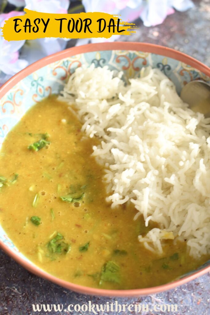 Toor Dal served in a bowl with steamed rice.