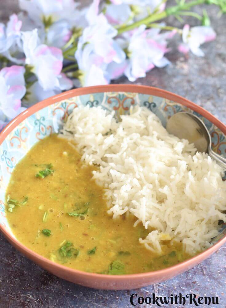 Toor Dal served in a bowl with steamed rice.