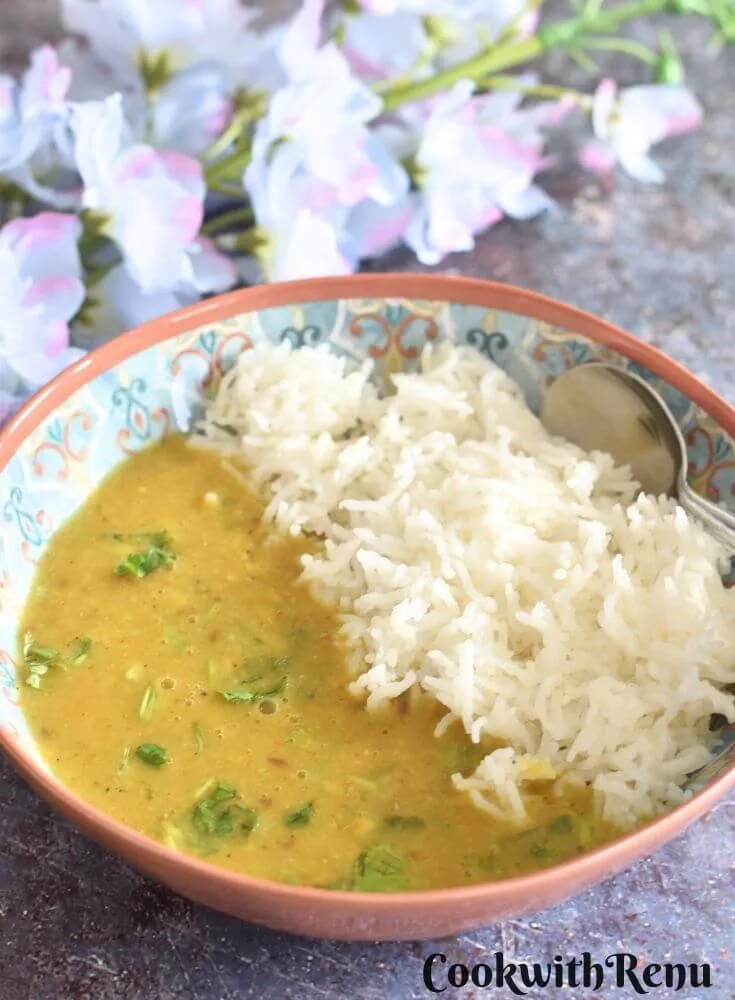 Toor Dal served in a bowl with steamed rice.