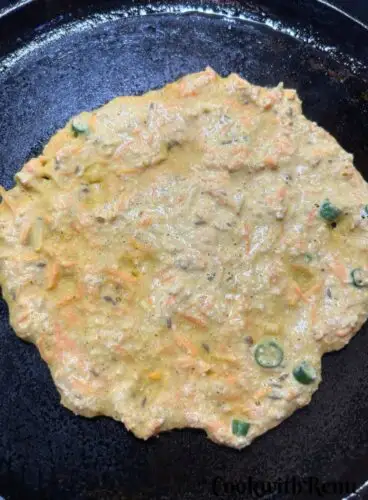 Oats Vegetable Chila spread on a gridle