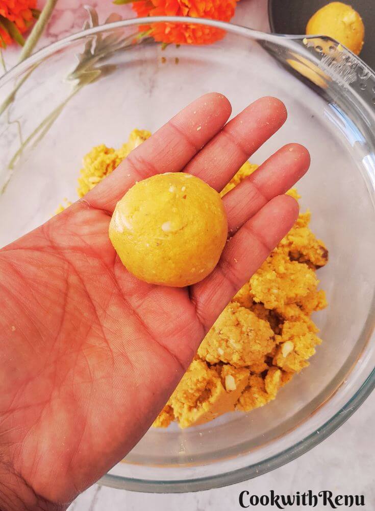 Pic showing besan ladoo being rolled.