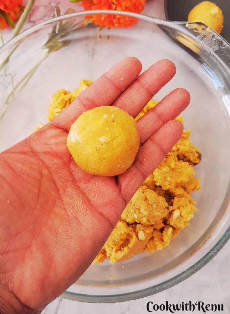 Pic showing besan ladoo being rolled.