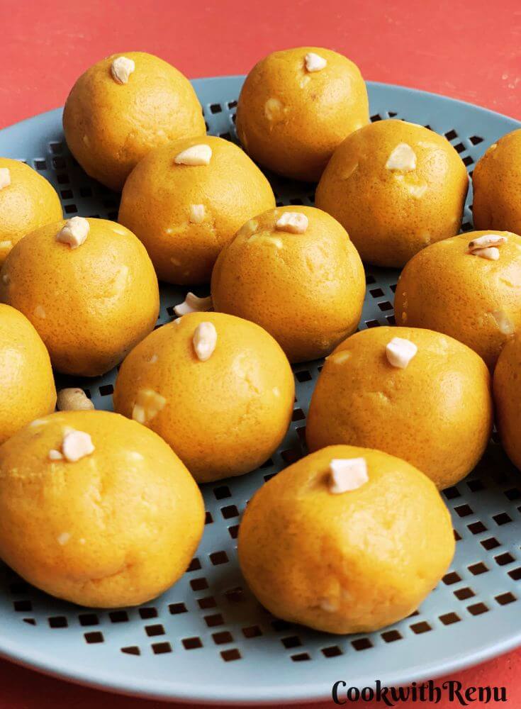 Besan Ladoo arranged in a blue plate.