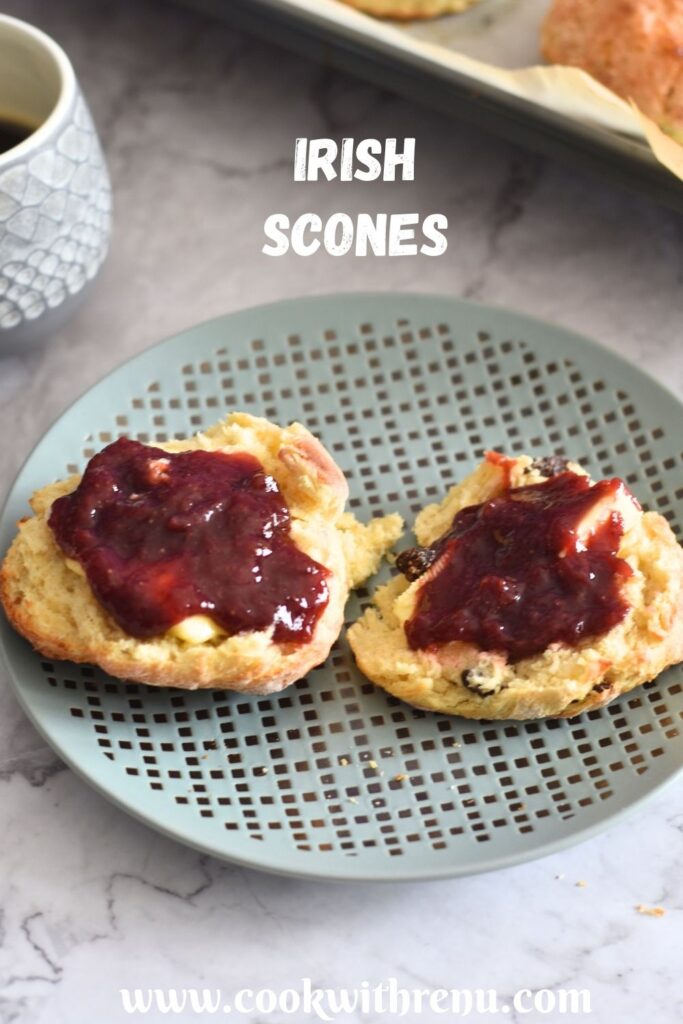 Irish Scones with butter and Jam served in a plate, with some black coffee.