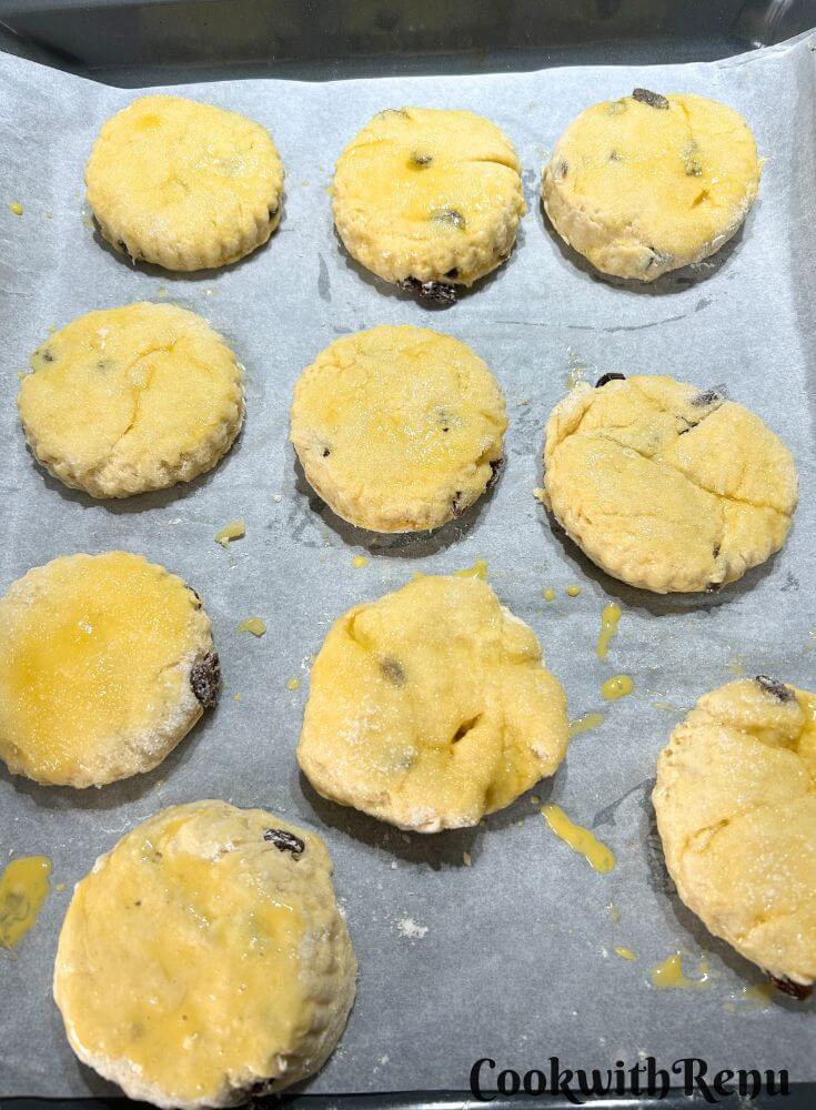 Scones Egg Washed, and sprinkled with sugar and arranged on a baking tray.