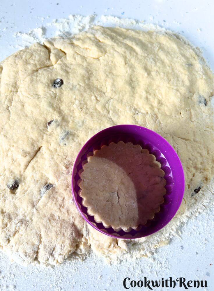 Shaping the scones with a cutter.