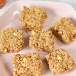 Rajgira Peanut Chikki arranged in a pink plate.