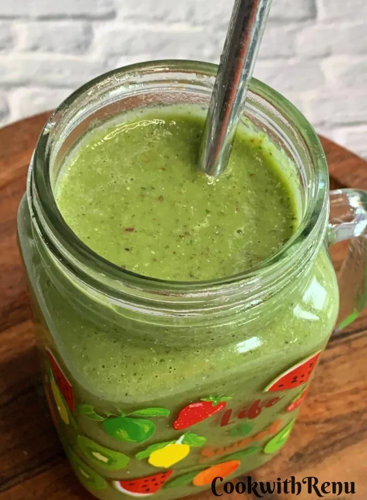 Top view of a Vegan Smoothie served in a glass along with a straw.