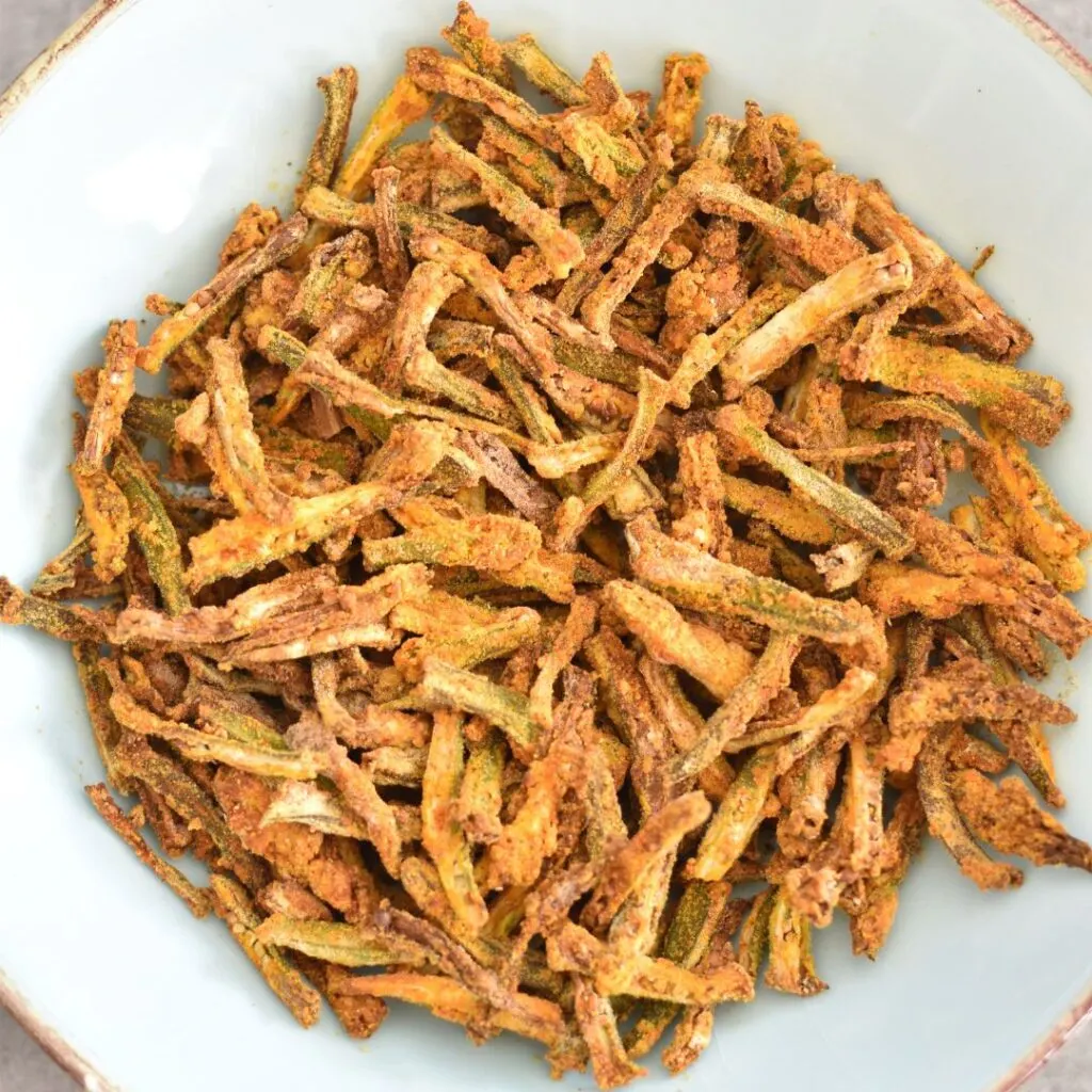 Air Fryer Bhindi in a light blue bowl.