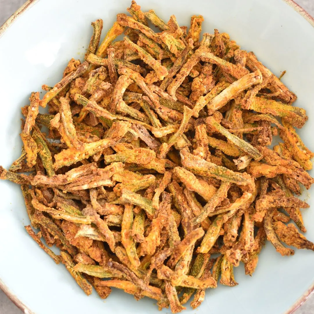 Air Fryer Bhindi in a light blue bowl.