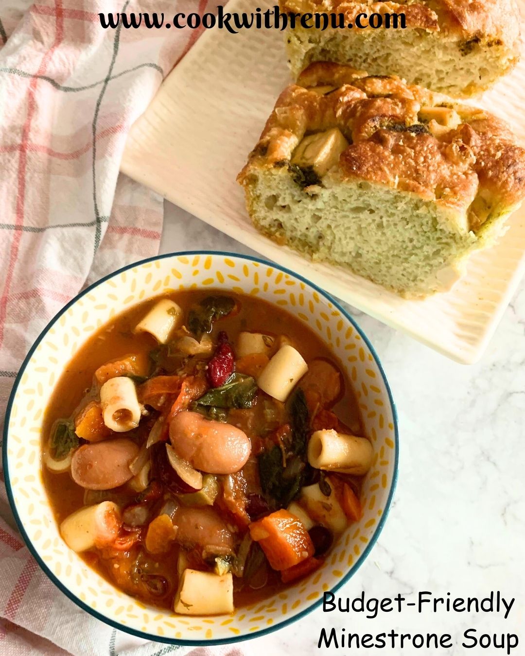 Minestrone Soup served in a bowl, seen in the background, is some chutney-spiced focaccia.