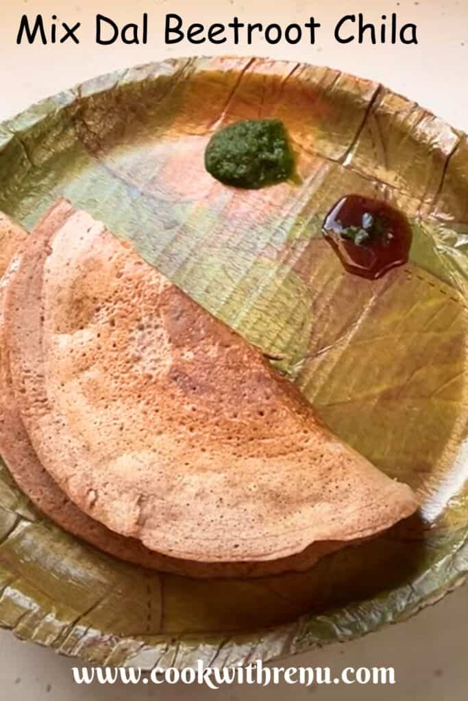 Mix Dal Beetroot Chila served in an eco-friendly plate along with green coriander and tamarind chutney.