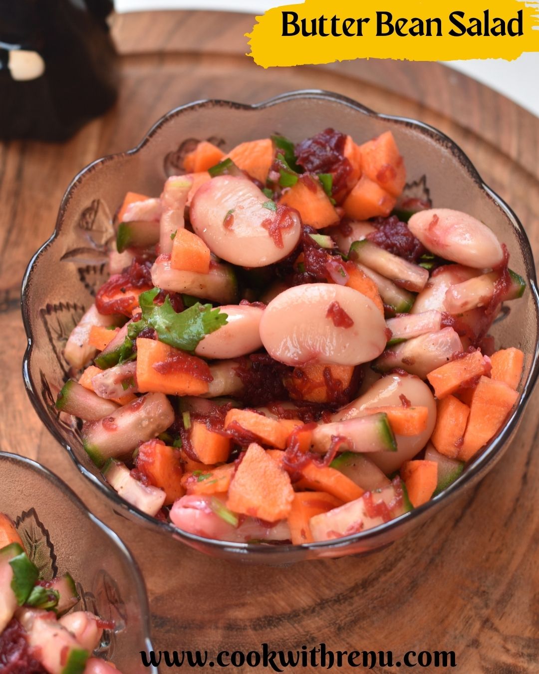 Butter Beans Salad served in 2 glass bowls and kept on a brown cheese board.